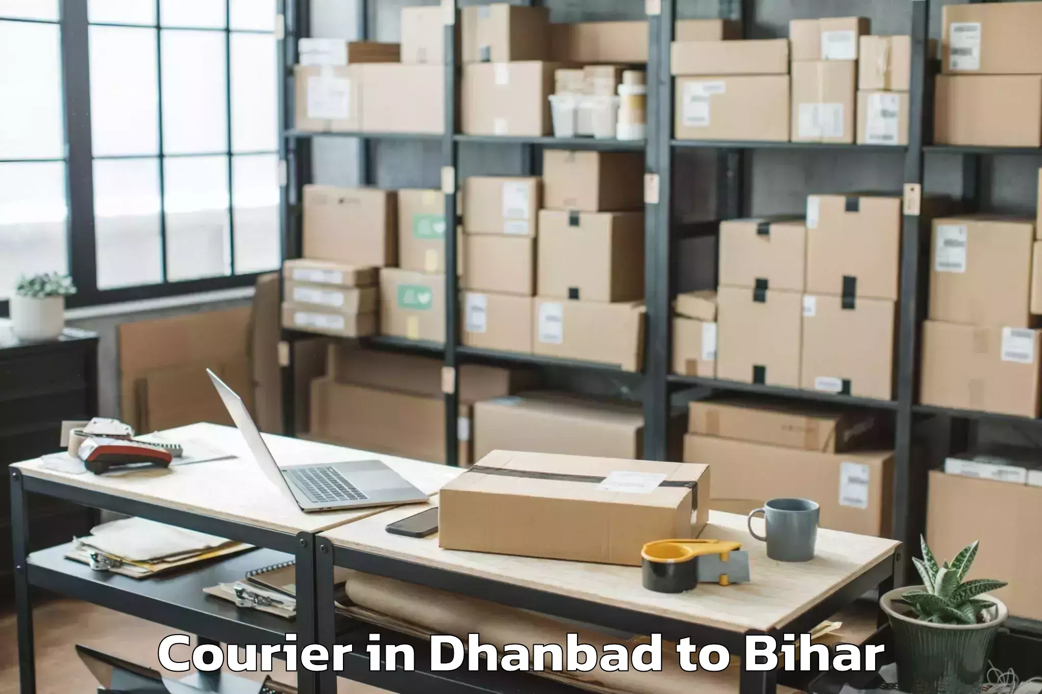 Easy Dhanbad to Bela Courier Booking